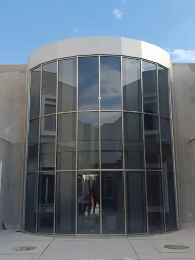 Continuous Two-Story Curtain Wall Facade – Benghazi Villa