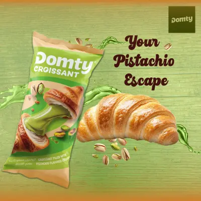 تصميم إعلان سوشيال ميديا لـ "Domty Croissant" بنكهة الفستق