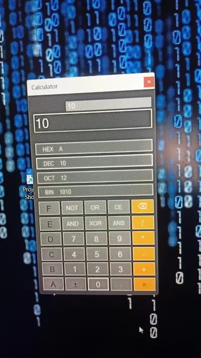 الة حاسبة قادرة على التحويل بين نظم العد و استخدام البوابات المنطقية